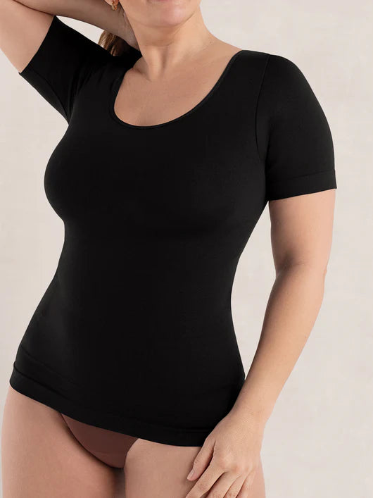 Front view of woman wearing a black short sleeve shaping t-shirt with everyday tummy control and comfort